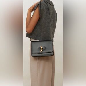 Elegant Black Leather Bag with Gold Accent